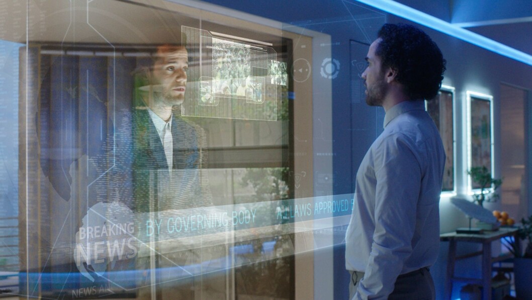 Oscar ser nyhetene i et hologram. Foto: National Geographic Oscar ser nyhetene i et hologram. Foto: National Geographic